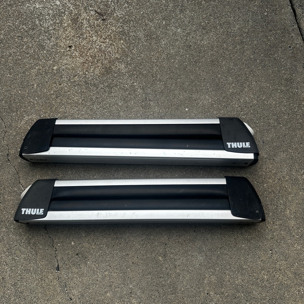 Thule Black and Silver Snowboard attachment set.